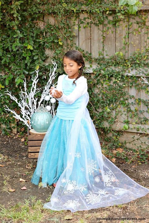 little girl dressed as else from frozen with blue tulle skirt