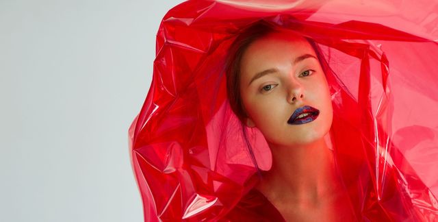 Red, Lip, Beauty, Outerwear, Mouth, Photo shoot, Textile, Photography, Latex, Raincoat, 
