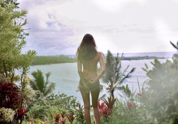 a person standing in front of a body of water