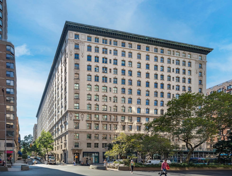 the exterior of the Belnord building, which stretches across an entire block and is surrounded by sidewalks and trees