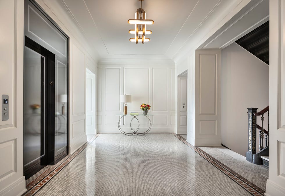 Residence lobby with satin nickel fittings, restored and polished mosaic floors and high-gloss wall paneling