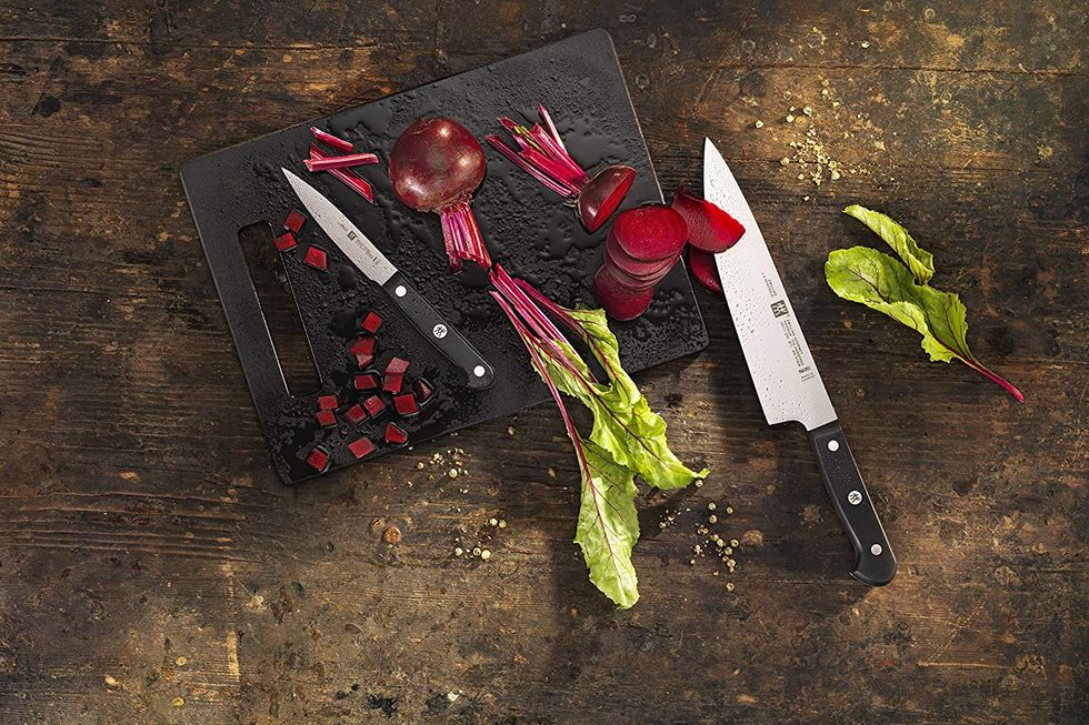 Two knives and a chopping board