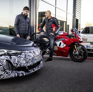 controllable performance in a double pack jaan mattes reiling left, technical project manager at audi in neckarsulm, and ducati chief tester alessandro valia after a ride in the prototype of the upgraded e tron gt and the ducati panigale v4 r