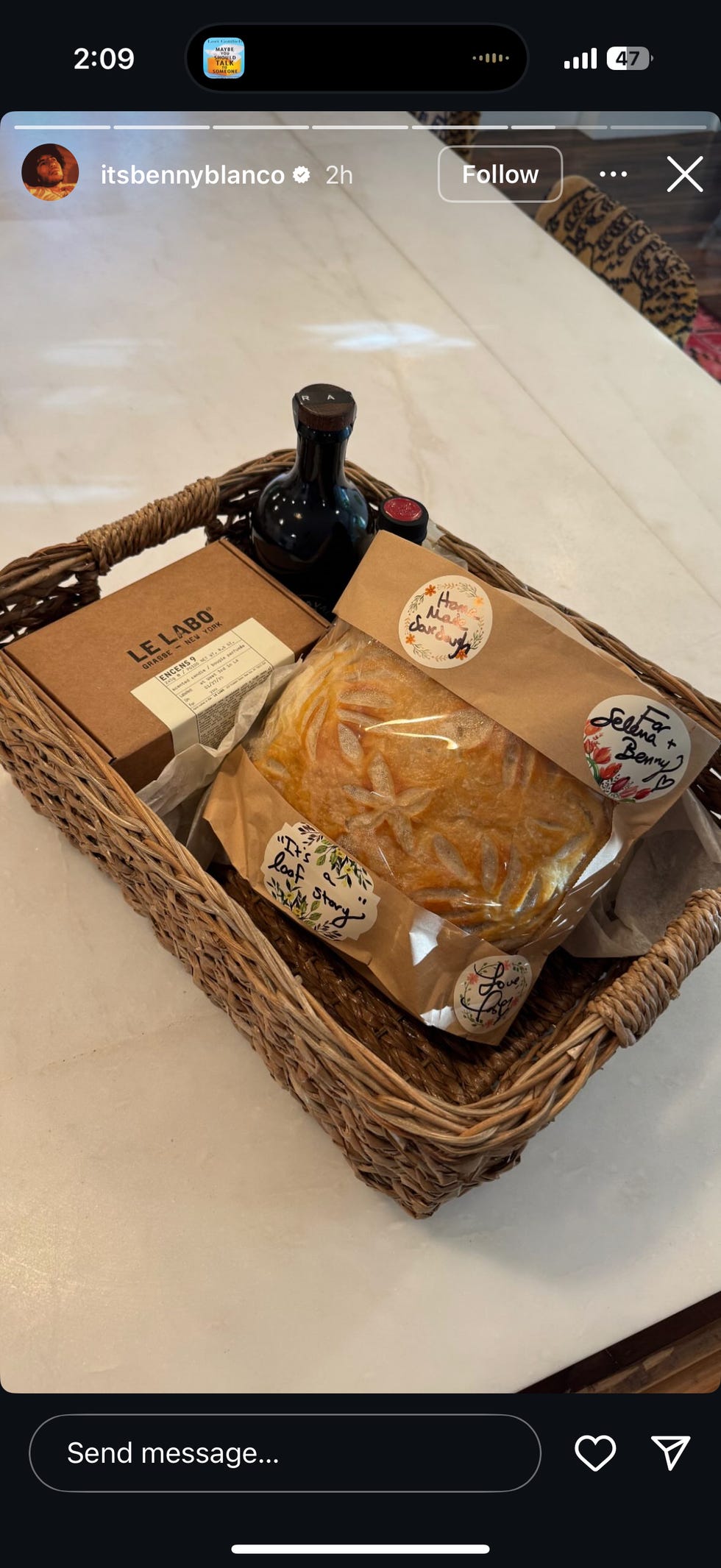 A wicker basket filled with gourmet food items.