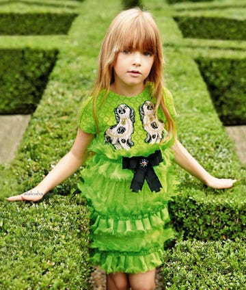 Green, Clothing, Child, Grass, Toddler, Dress, Pattern, Yellow, Pattern, Sleeve, 