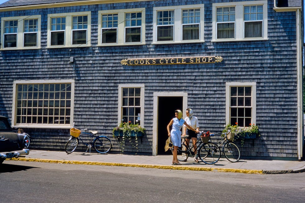 Two Women with Bicycles in front of Cycle Shop, Nantucket, Massachusetts, USA, Toni Frissell Collection, August 1957