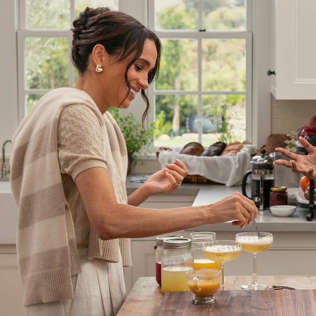 with love meghan markle products two women engaging in conversation while preparing drinks in a kitchen