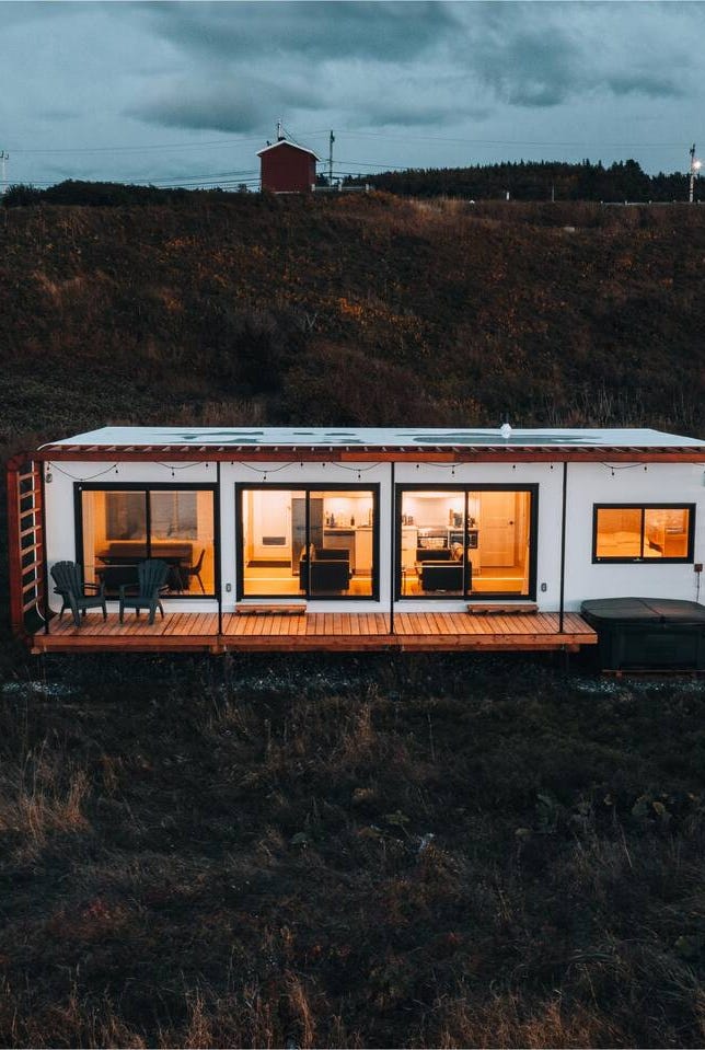 a house with a glass front a house with a glass front