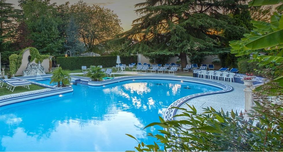 Swimming pool, Real estate, Azure, Resort, Garden, Resort town, Landscaping, Reflection, Yard, Estate, 