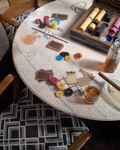 a table with a poker set and glassware