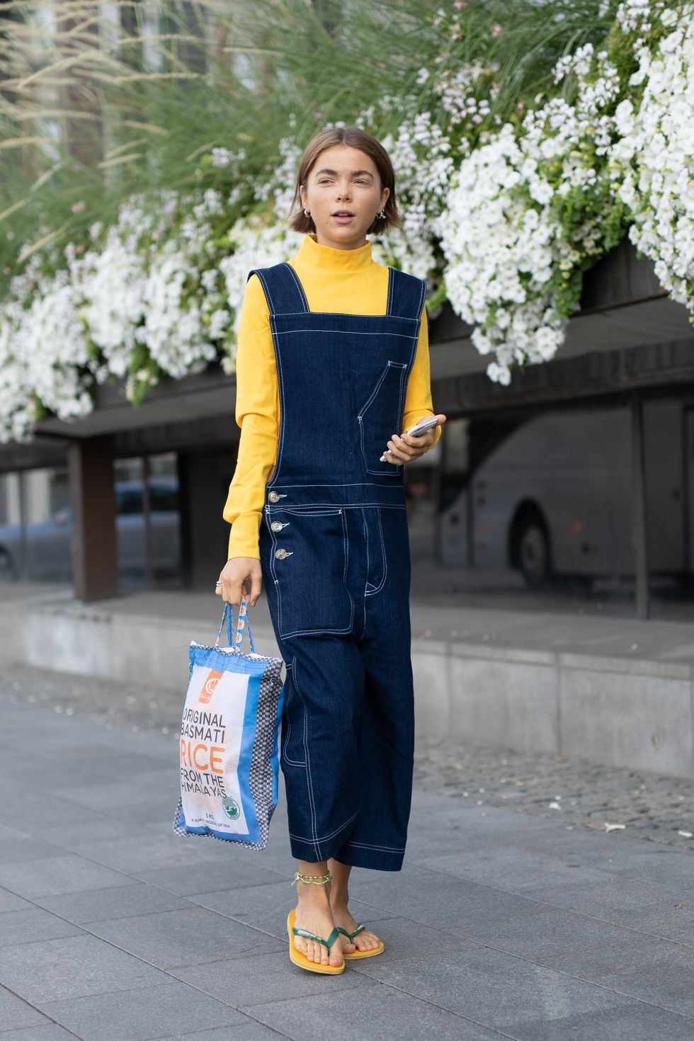 stockholm, sweden august 28 a guest is seen on the street during fashion week stockholm wearing blue overalls with yellow turtleneck and sandals on august 28, 2018 in stockholm, sweden photo by matthew sperzelgetty images
