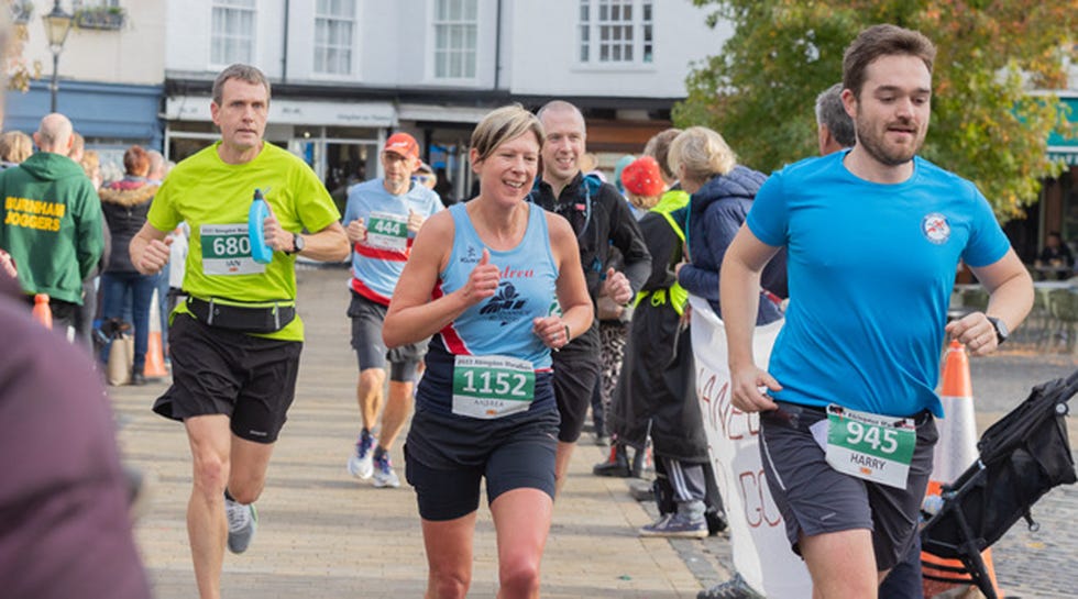 a group of people running in a race