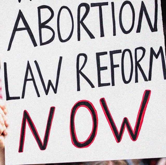 a sign reading abortion law reform now