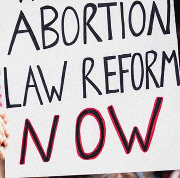 a sign reading abortion law reform now