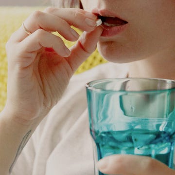 a woman holding a cup