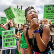 abortion rights demonstrator elizabeth white leads a chant in response to the dobbs v jackson women's health organization ruling in front of the us supreme court on june 24, 2022 in washington, dc