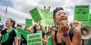 abortion rights demonstrator elizabeth white leads a chant in response to the dobbs v jackson women's health organization ruling in front of the us supreme court on june 24, 2022 in washington, dc