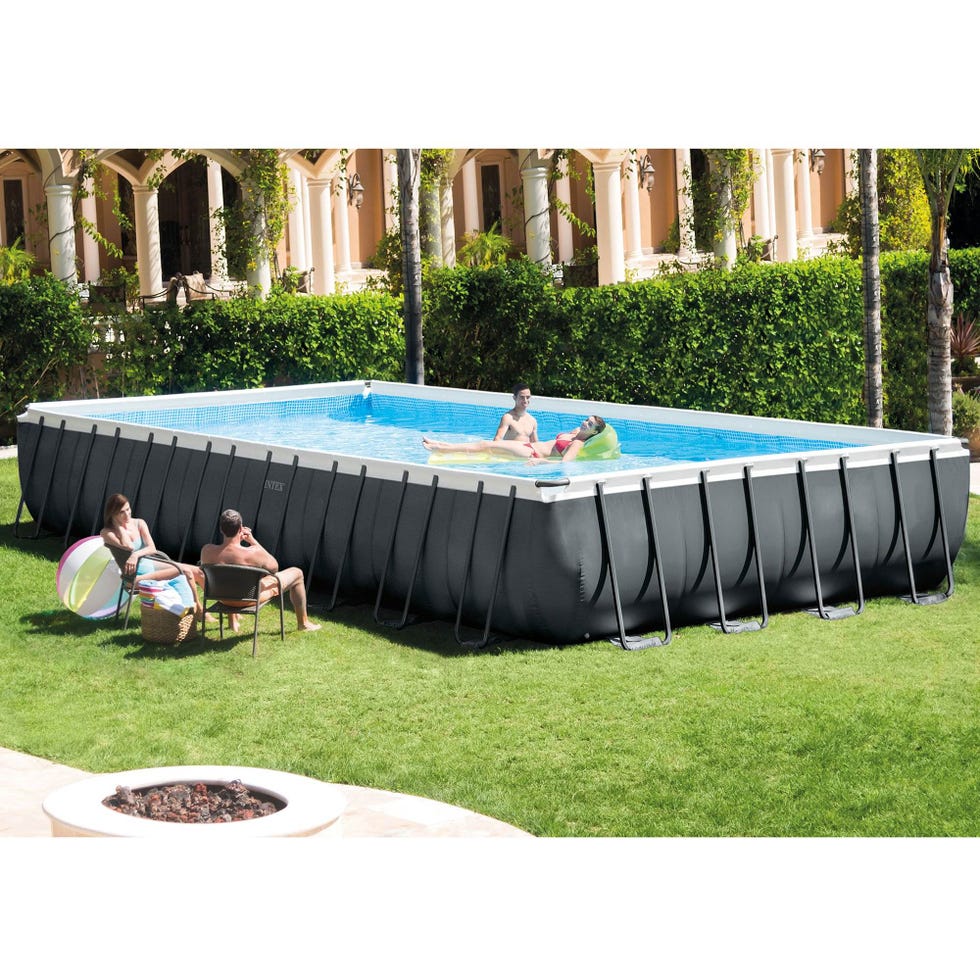 a group of people sitting around a pool