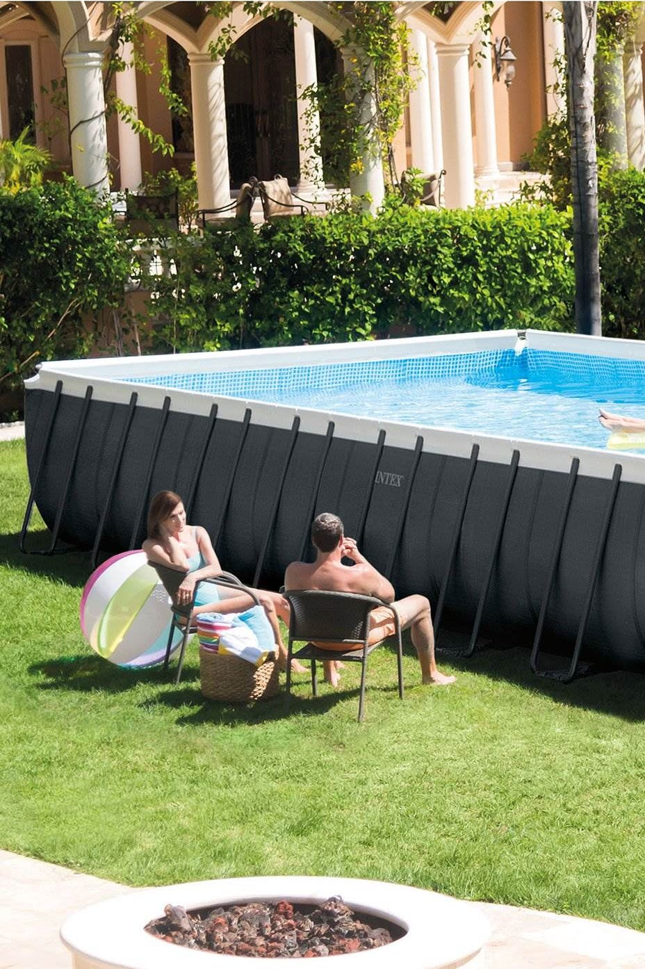 a group of people sitting around a pool a group of people sitting around a pool