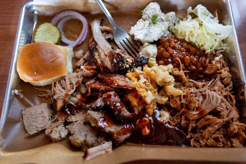 above view of barbecue and sides on trays