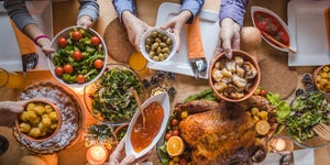 above view of passing food during thanksgiving dinner