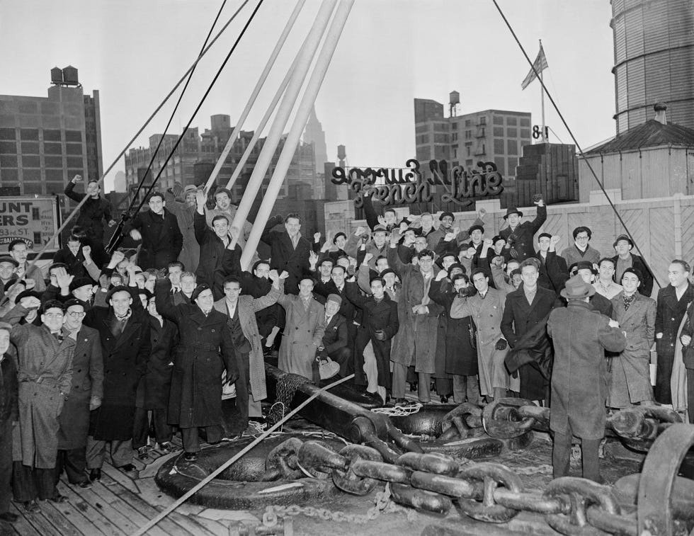 Leden van de Abraham Lincoln Brigade vieren in 1938 hun aankomst in New York nadat ze in de Spaanse Burgeroorlog aan Republikeinse zijde tegen de fascisten hebben gevochten