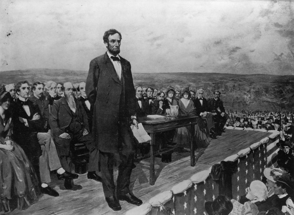 a painting of the gettysburg address with abraham lincoln standing on a stage and talking to a crowd