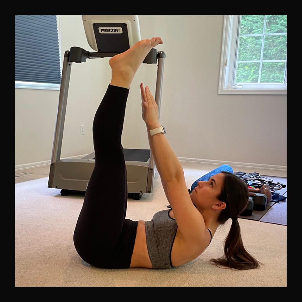 exercise routine focused on core strengthening with raised legs and arms