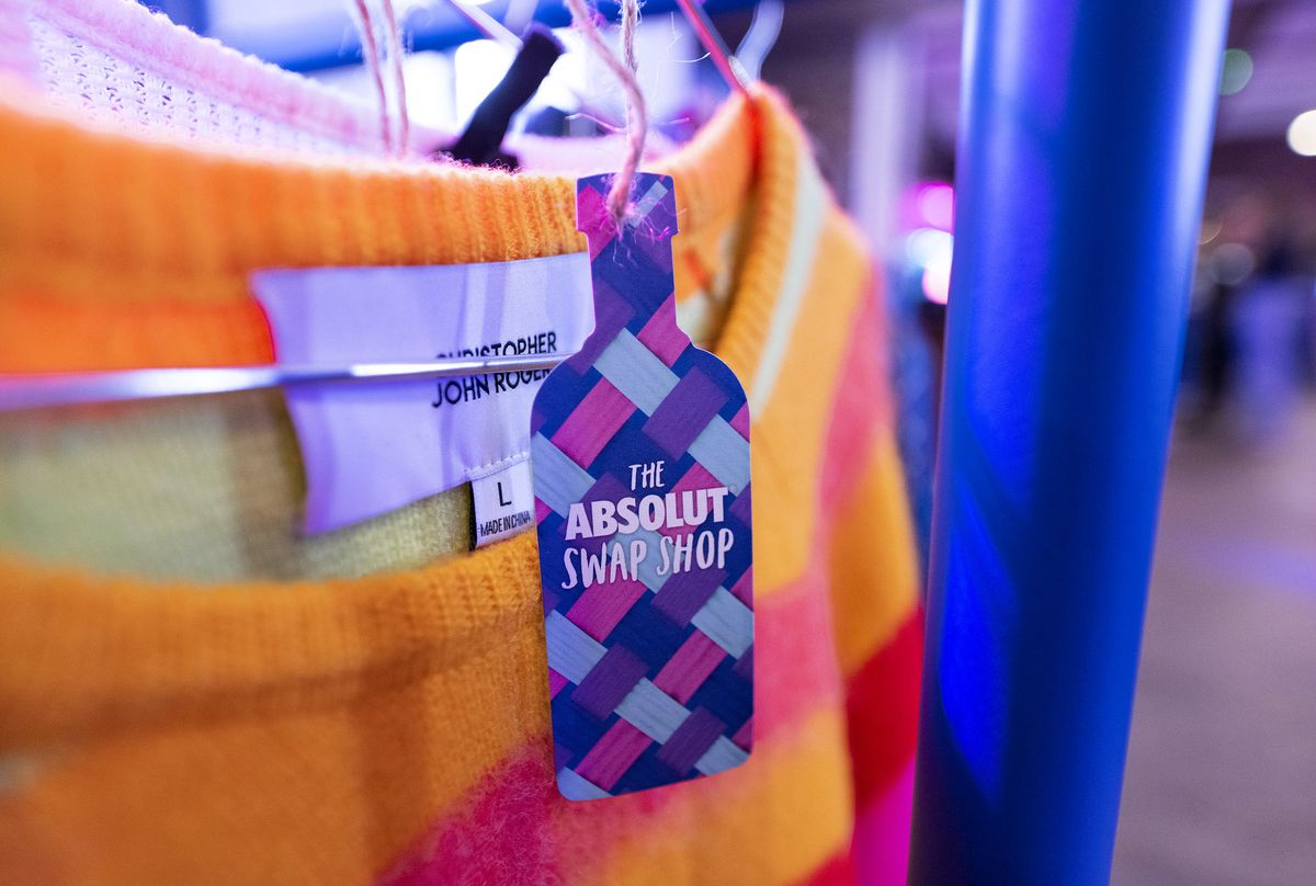 close up of orange jumper on rail for absolut swap shop