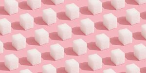 abstract pattern made of sugar cubes on pink minimal style background