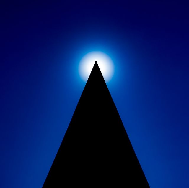abstract silhouette of pyramid with sun