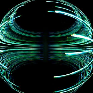 abstract sphere made of multicolored light trails on black background abstract long exposure