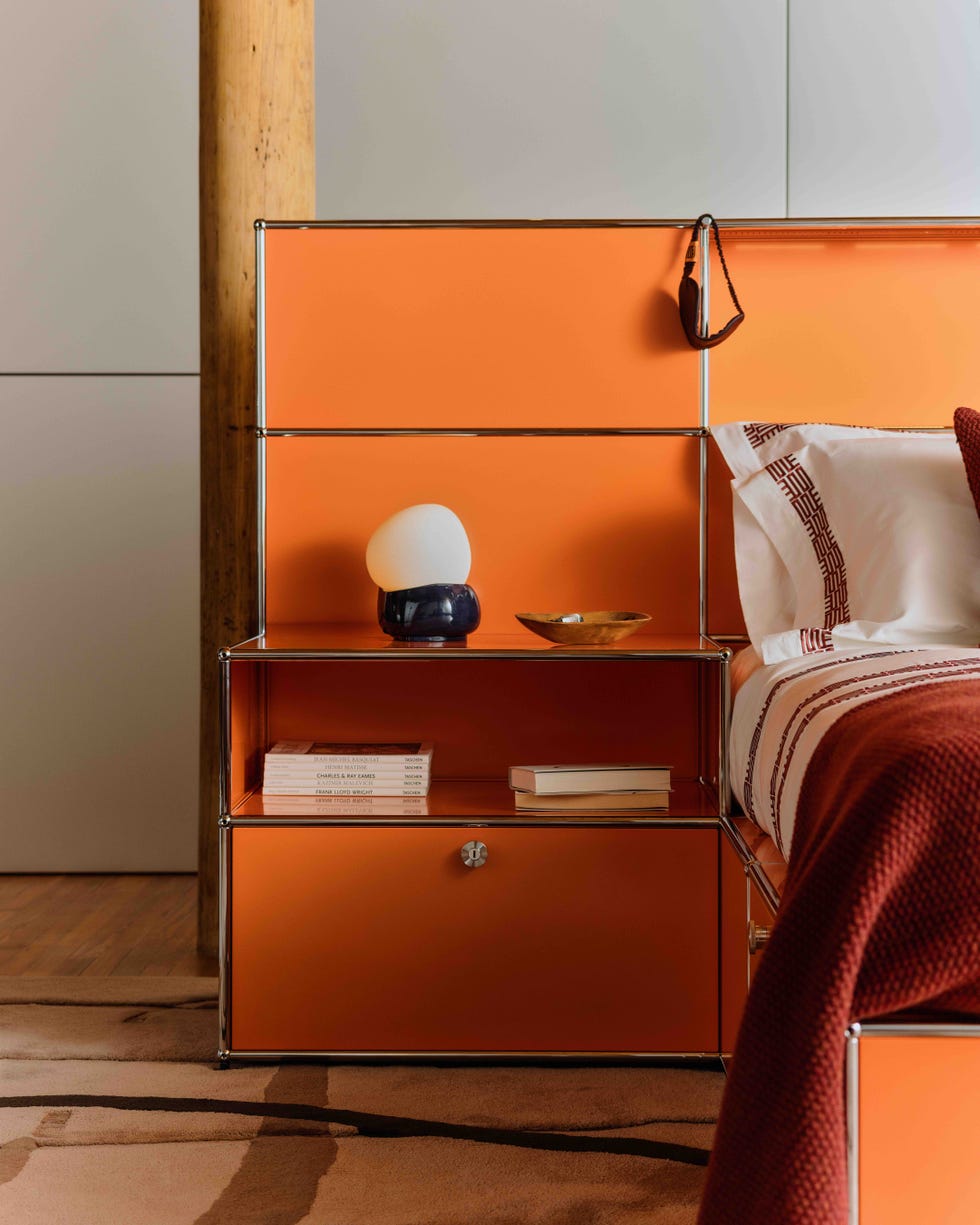 an orange bed with adjoining headboard