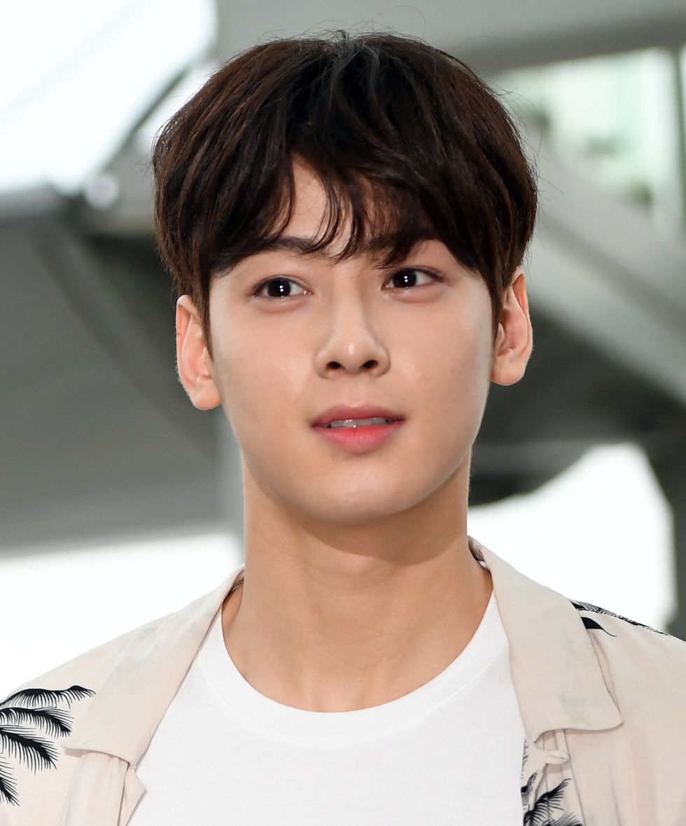 cha eun woo poses for pictures after arrived at incheon international airport on july 27th in incheon, south korea photoosen