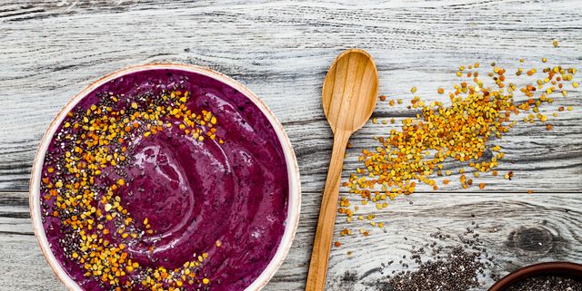 Acai breakfast superfoods smoothies bowl with chia seeds, bee pollen