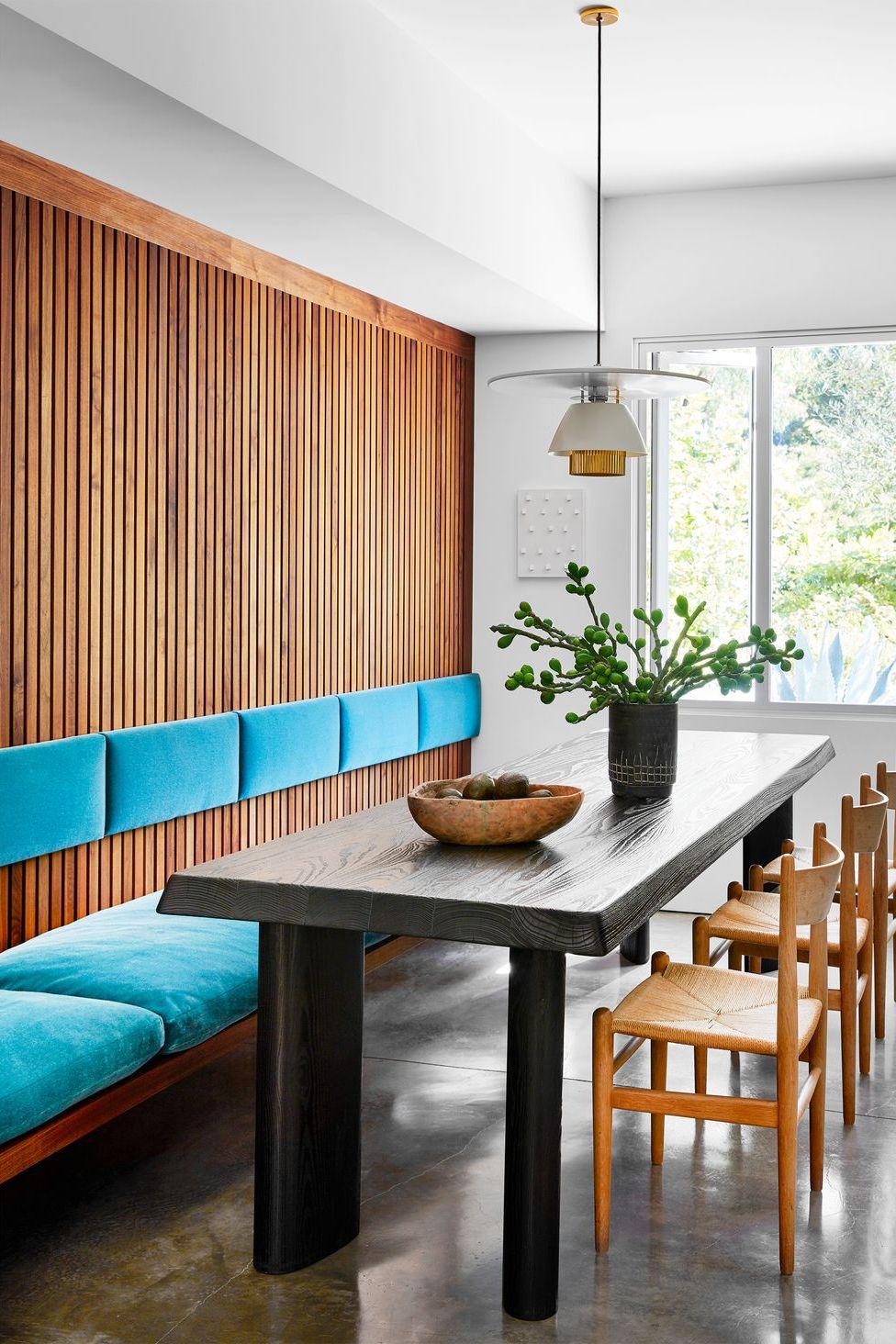dining area with wood paneling wall