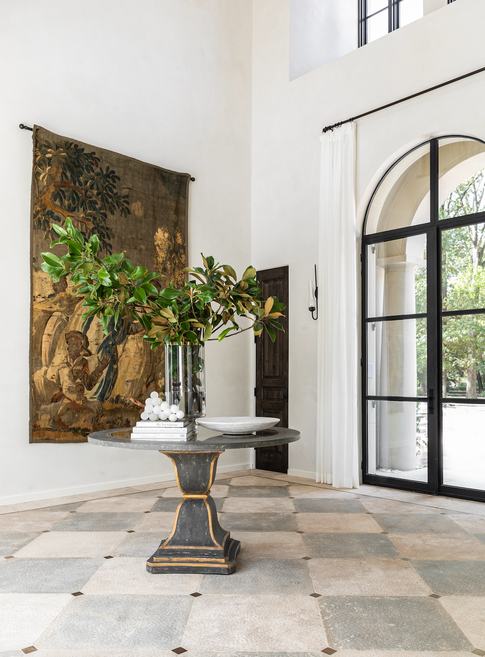 accessible home trends, large entryway with a table and flowers in the center