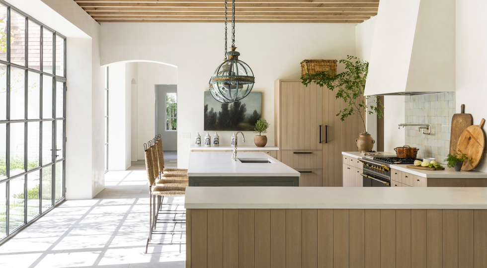 accessible home trends, wide hallway in the kitchen with large windows beside it