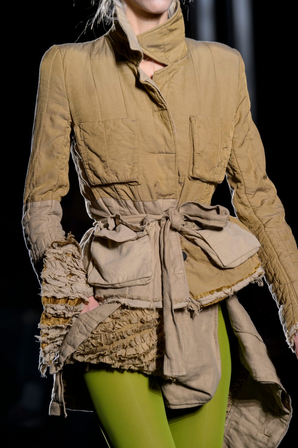 Fashion model, Clothing, Fashion, Trench coat, Fashion design, Outerwear, Coat, Beige, Sleeve, Haute couture, 