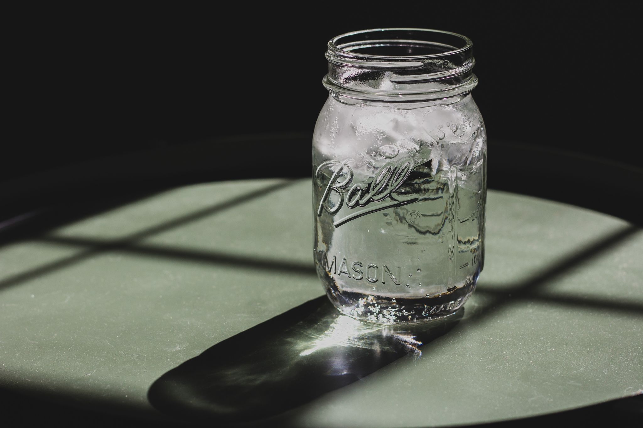 Mason jar, Water, Glass, Drinkware, Still life photography, Black-and-white, Transparent material, Tableware, Glass bottle, Photography, 