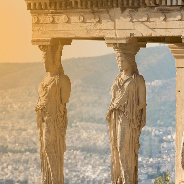 the karyatides statues at sunset inside acropolis of athens
