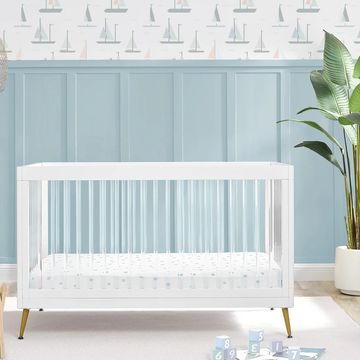 acrylic crib in blue nursery
