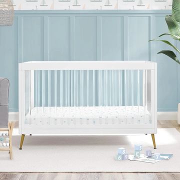 acrylic crib in blue nursery