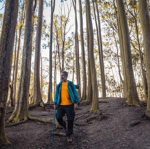 active man enjoying outdoors excursion walking