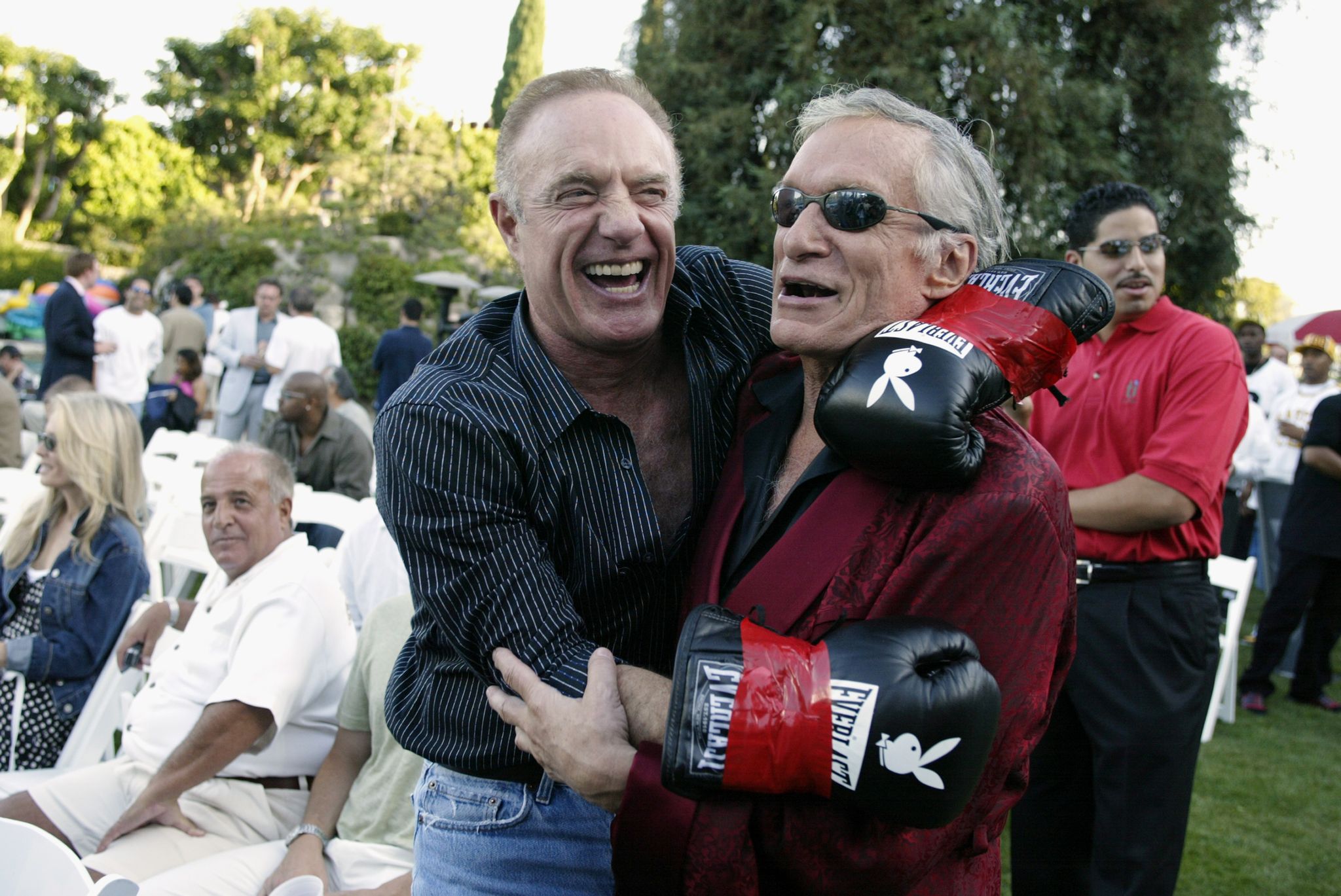 cann and hefner at the playboy mansion fight night