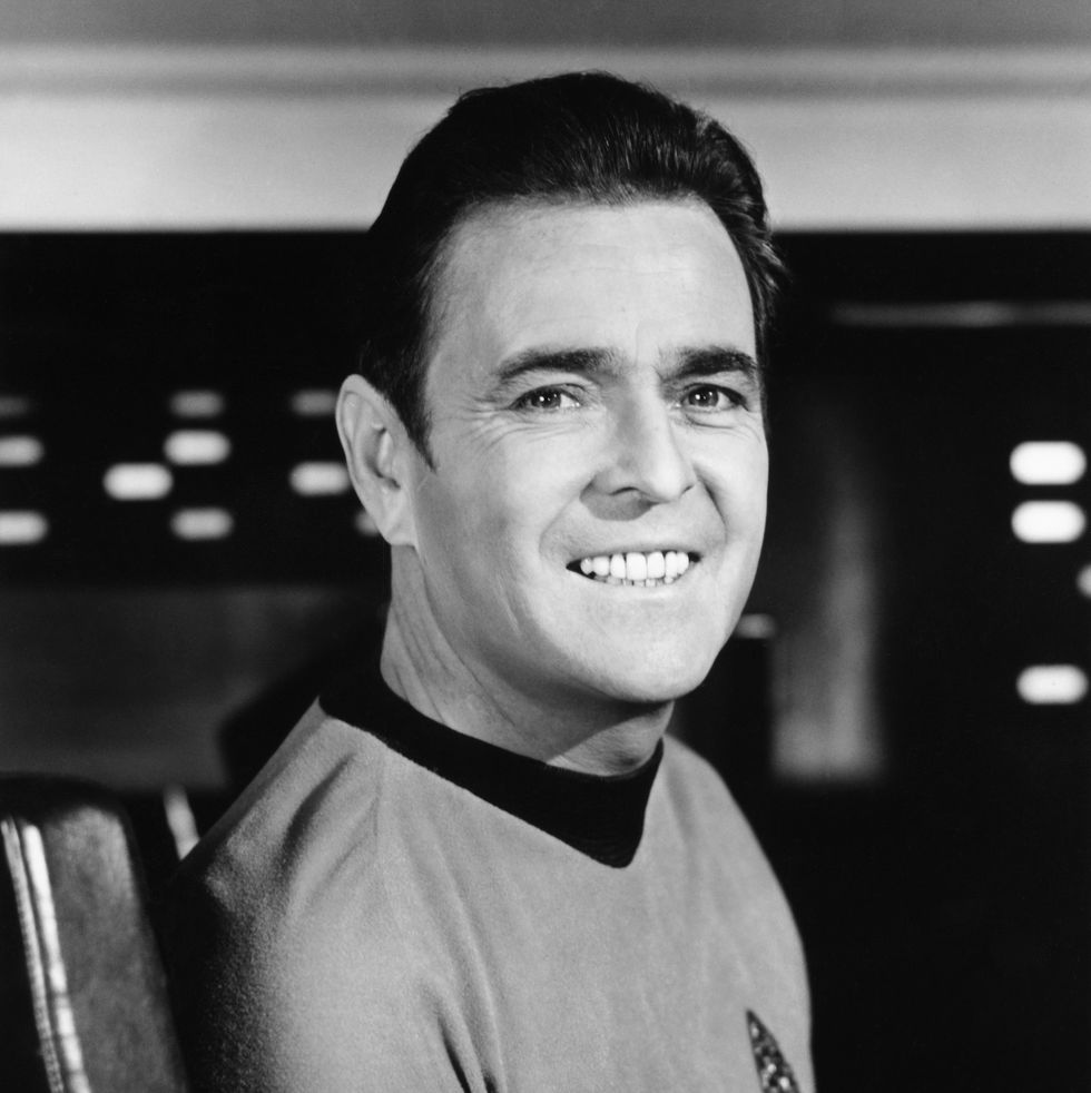 james doohan smiling for a photo in his star trek costume