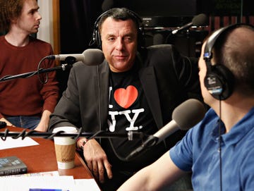 tom sizemore sitting at microphone in radio studio talking to interviewer