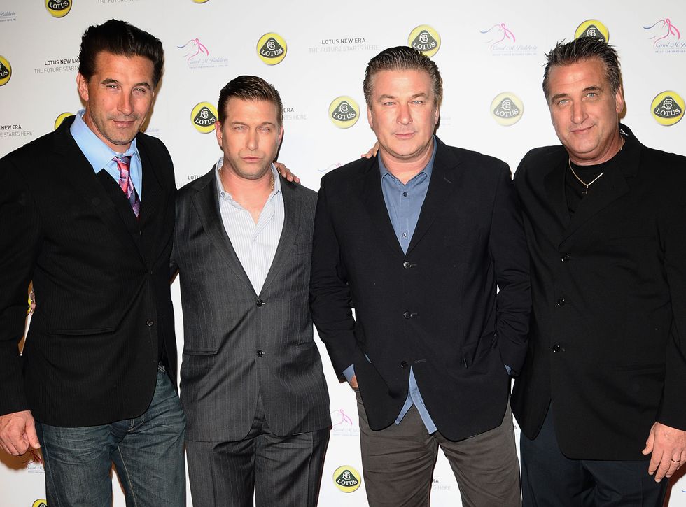 the baldwin brothers standing arm in arm for a photograph