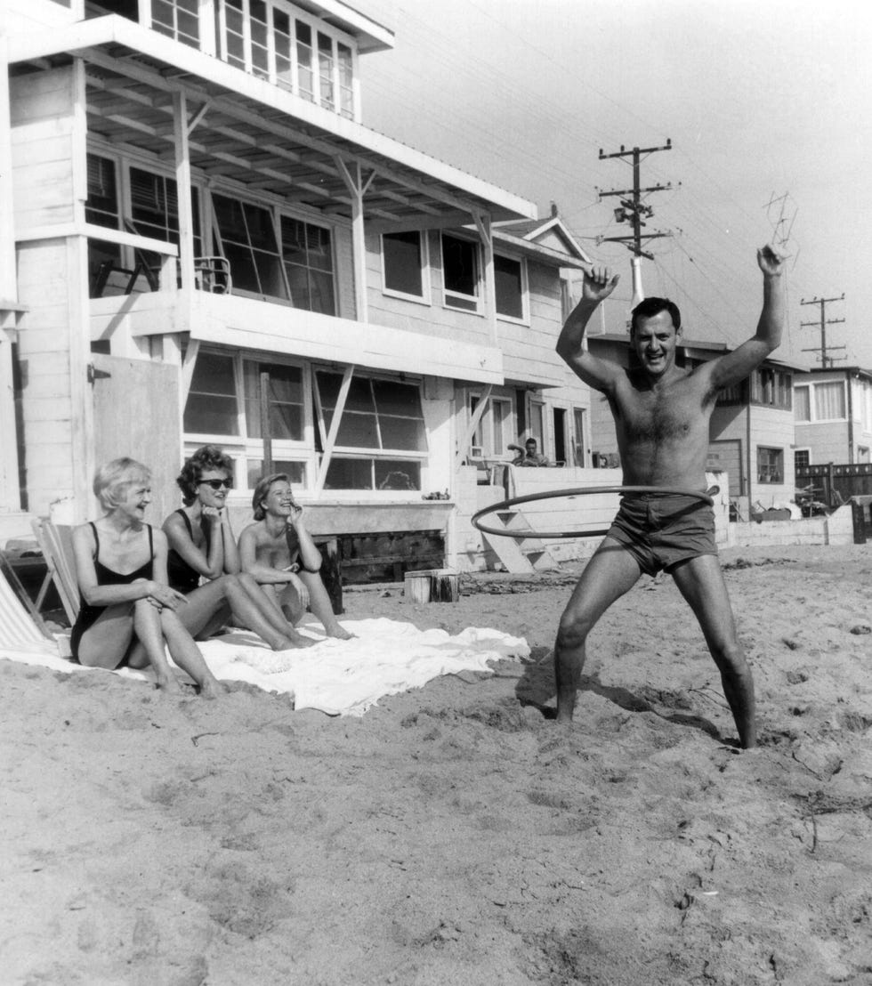 tony randall and wife florence with guests at the beach