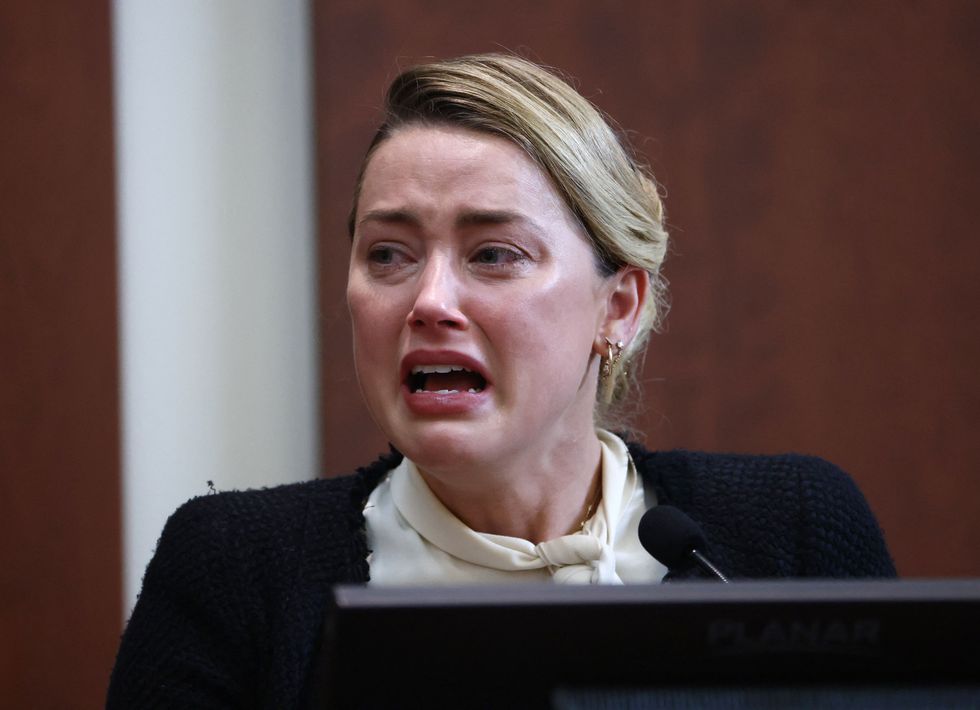 amber heard crying as she speaks while testifying in court